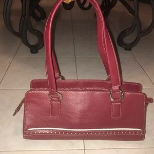 Red handbag. It’s brand is Tommy Hilfiger.